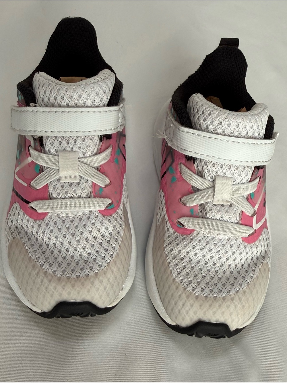 New Balance White and Pink Kids Sneakers with Teal Accents